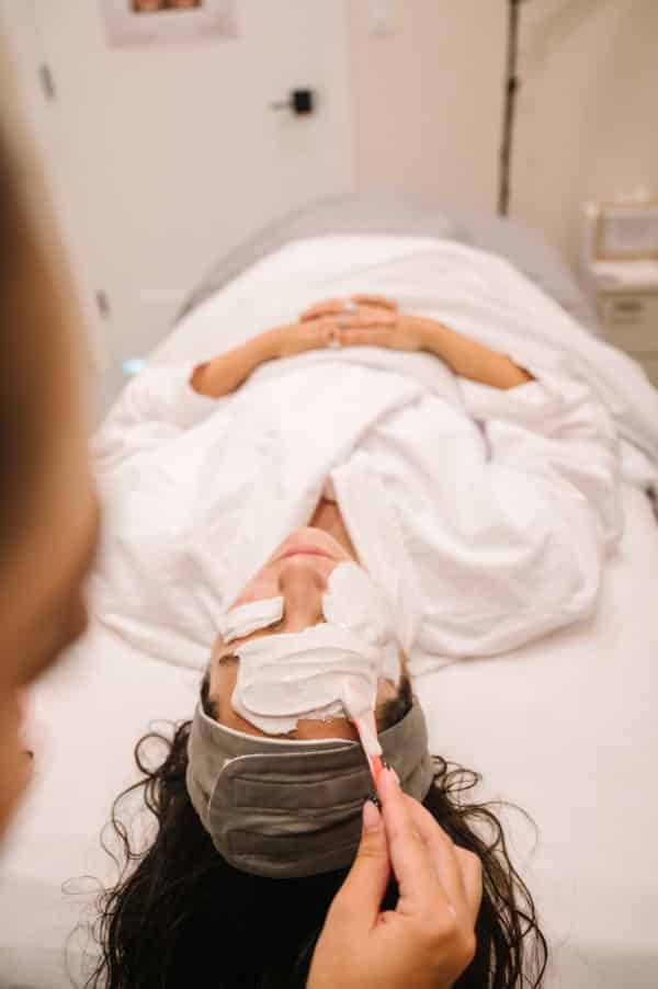 A woman receiving a facial treatment at Summit Medical Spa