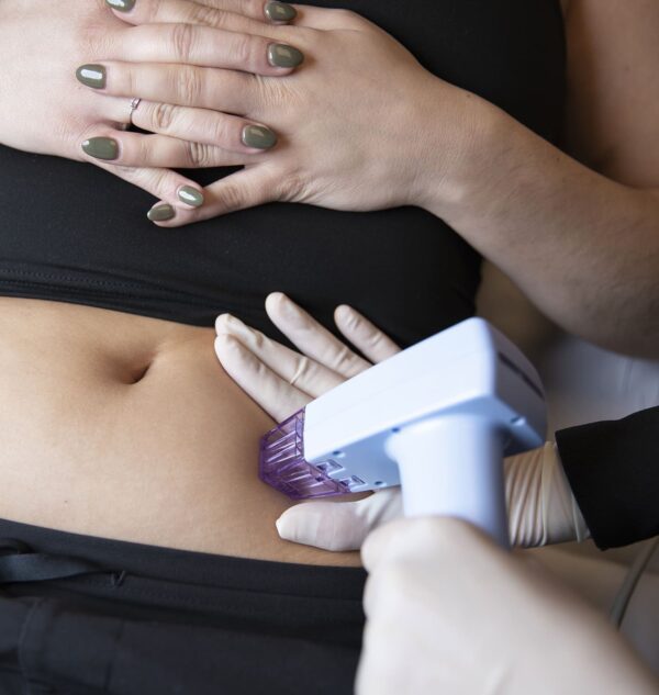 Client receiving weight loss injection treatment